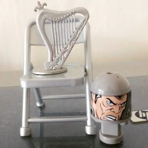 The Silver Harp stands upon the fold-up chair.