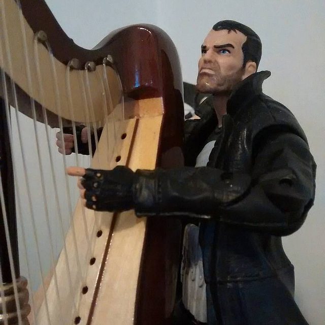 Punisher gazing up to the Heaven's again as he plays his harp.