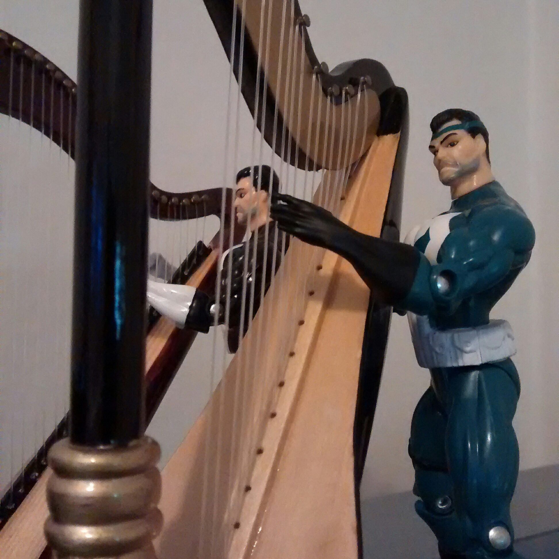 He's very pleased with the harp's sound.