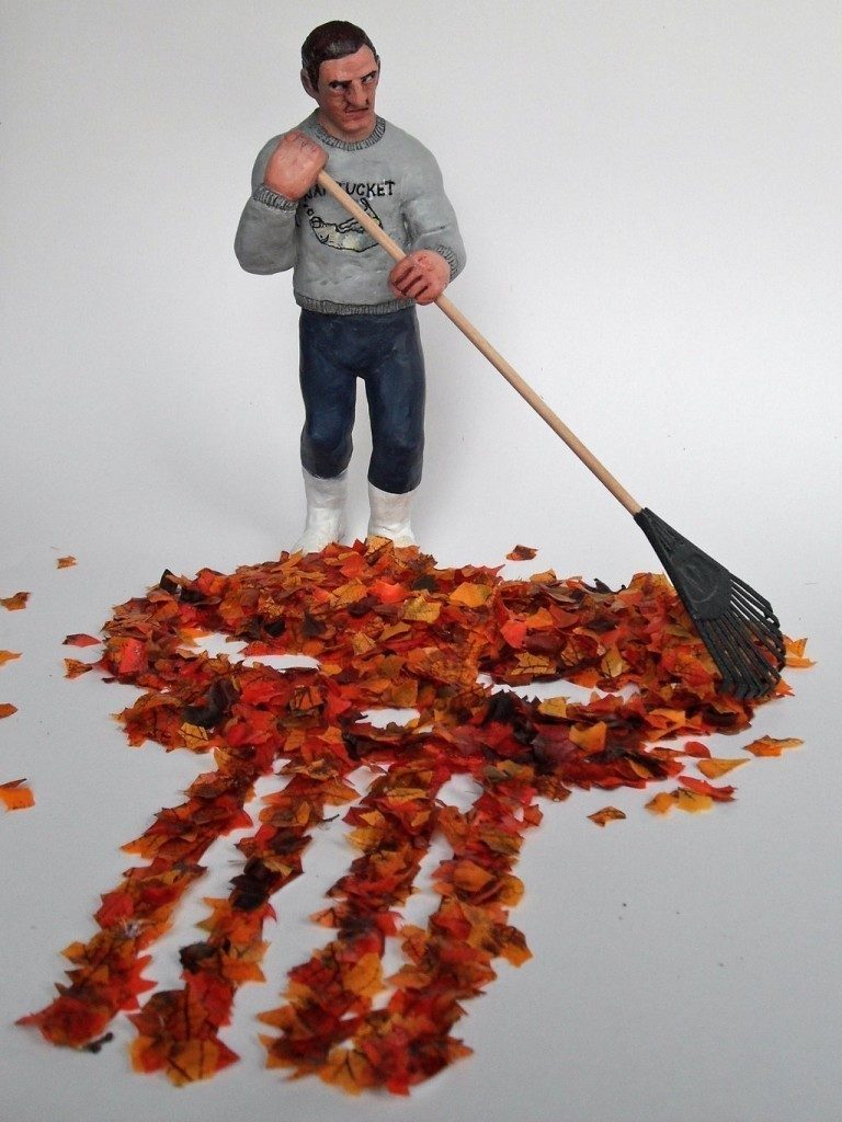 Punisher raking leaves.