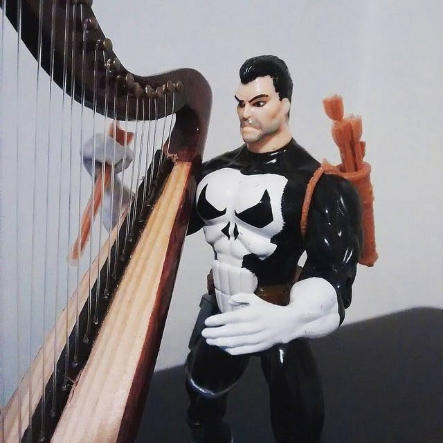 Punisher practicing his "Harp skills"