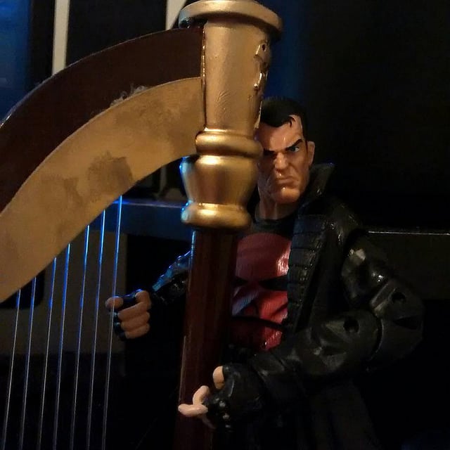 The Punisher cuddles with his harp.