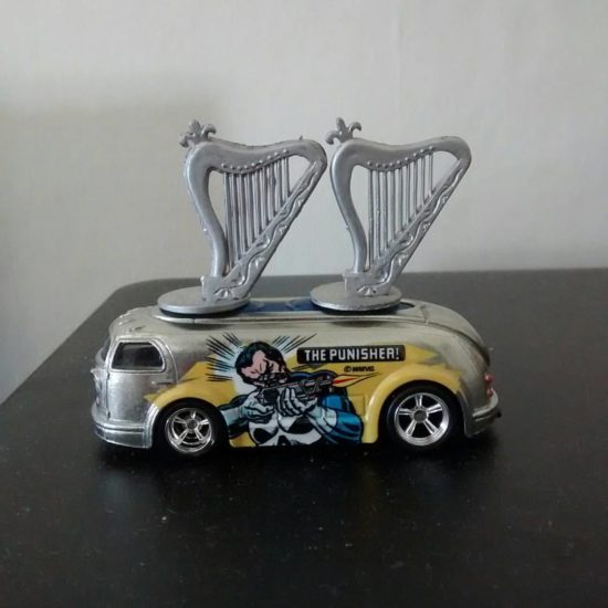 Harp Gigging. Two harps on top of The Punisher Hot Wheels "Hauling Gas" vehicle.